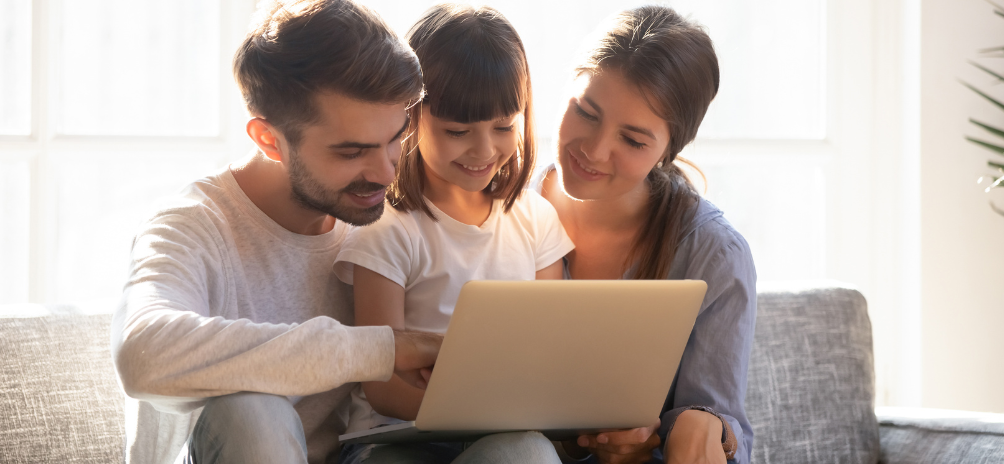 Child and parents studying a painting up close during an art observation activity for kids